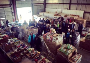 Food drive volunteers and collected donations.
