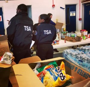 Federal employees picking up donated food.
