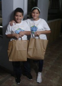 Children with food packs in Puerto Rico