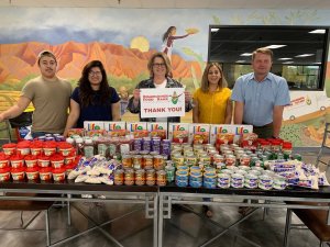 Roadrunner Food Bank staff with donations