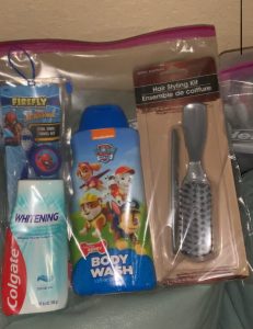 Spider-Man toothbrush, Paw Patrol body wash, toothpaste, and a brush