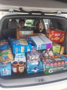 A car trunk full of food and supplies