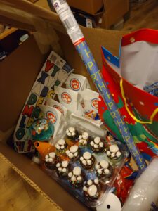 A Birthday Box full of party bags, decorations, and food treats to enable holding a child's birthday party